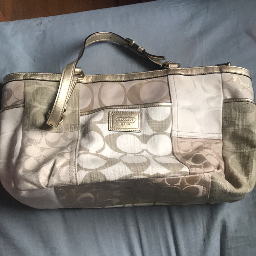 Tan and gold Coach purse. Very good used condition
